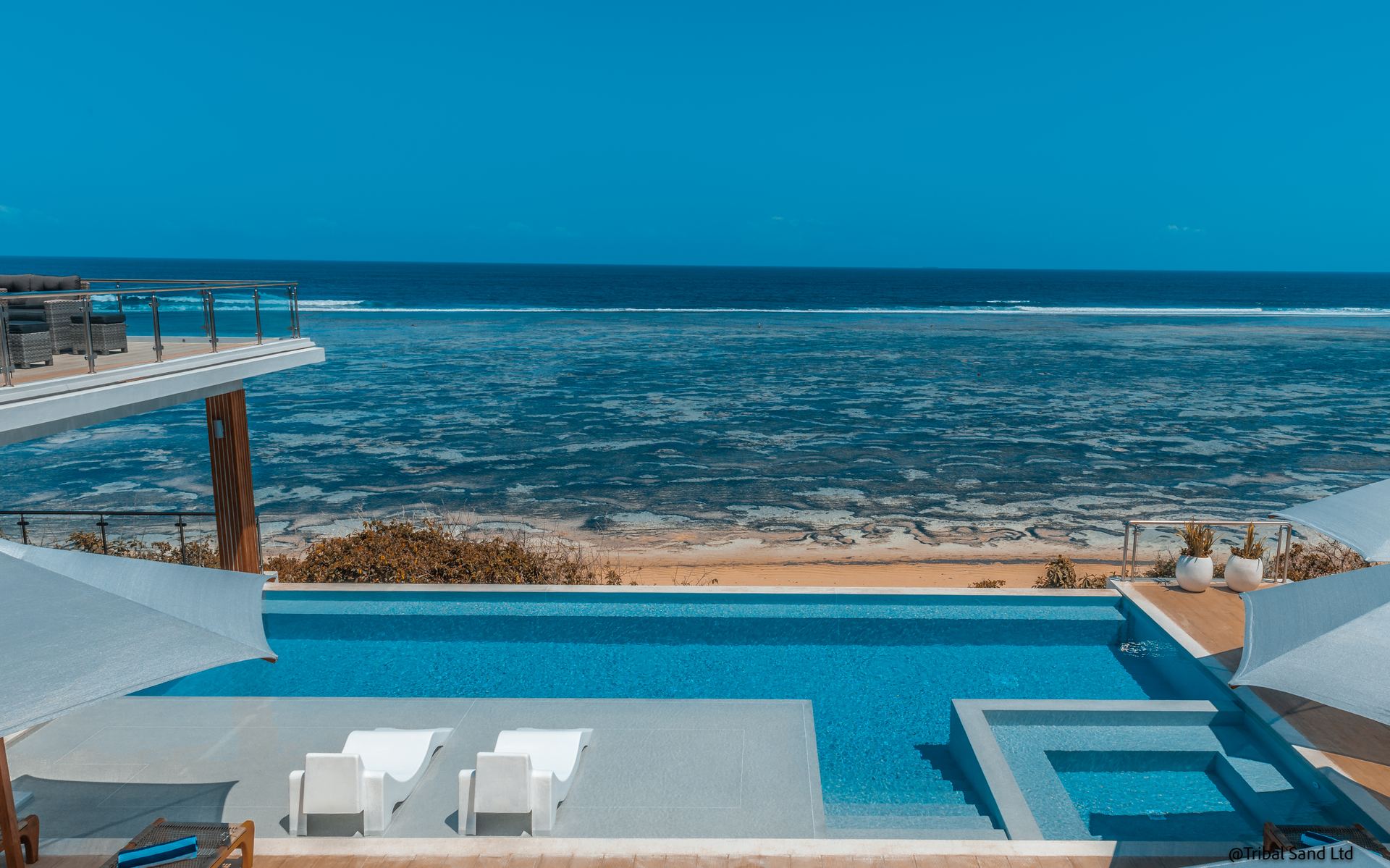 The infinity pool at My Amani looking out over the reef and the Indian Ocean