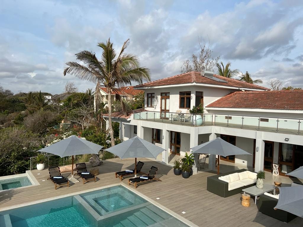 My Amani villa and pool deck with shaded loungers